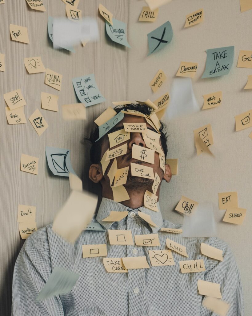 founder thinking about startup growth with post its on his face and everywhere