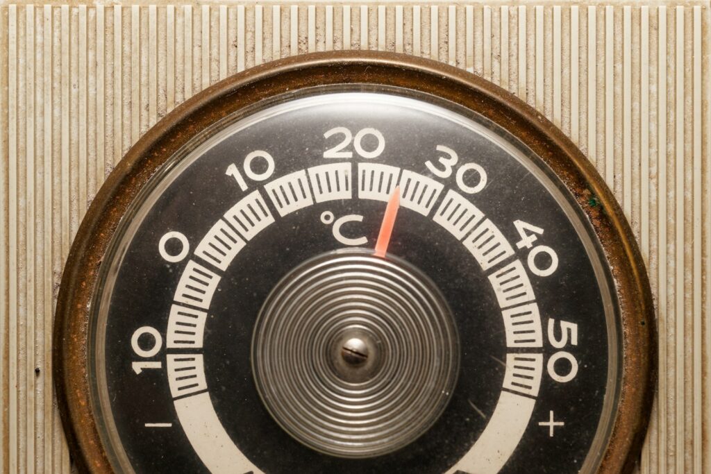 take temperature of startup growth through thermometer on a wall