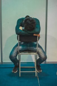 founder mental health shown by tired a person sitting in a chair