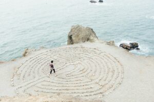 person walking on beach during daytime as they can't focus under pressure